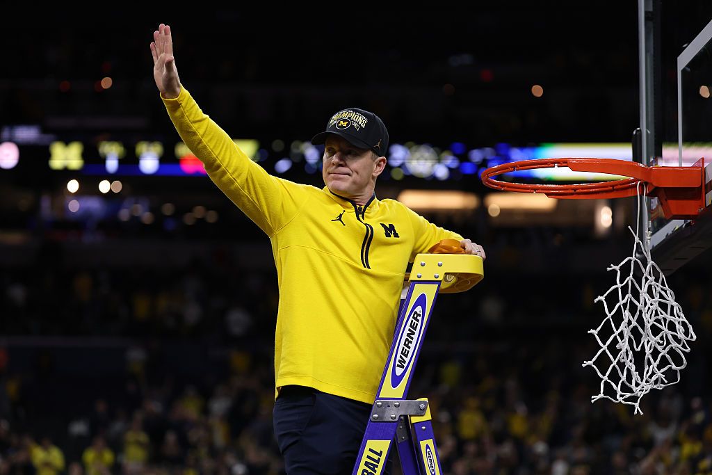 Dusty May cutting the nets 4-15-26.jpg